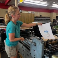 A participant creating a print